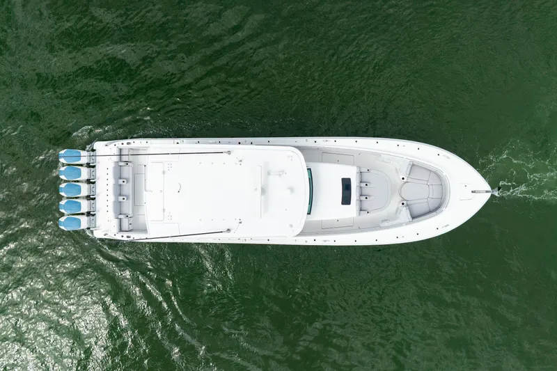 Slide: The Image of Aerial view of 2026 HCB 56 Suenos GIX boat on green water. - 9