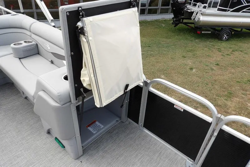 Slide: The Image of 2023 Bennington 20 SVF pontoon boat interior with seating and storage area. - 19