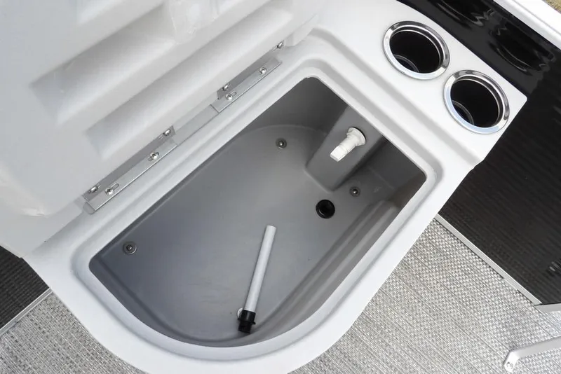 Slide: The Image of 2023 Bennington 20 SVF boat compartment with cup holders and drainage system. - 20