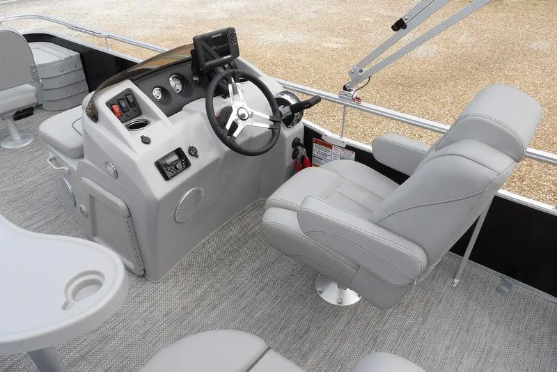 Slide: The Image of 2023 Bennington 20 SVF boat interior with steering console and comfortable seating. - 27