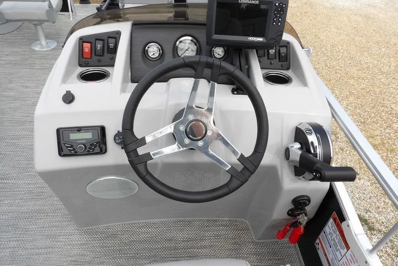 Slide: The Image of 2023 Bennington 20 SVF boat dashboard with steering wheel and control panel. - 28
