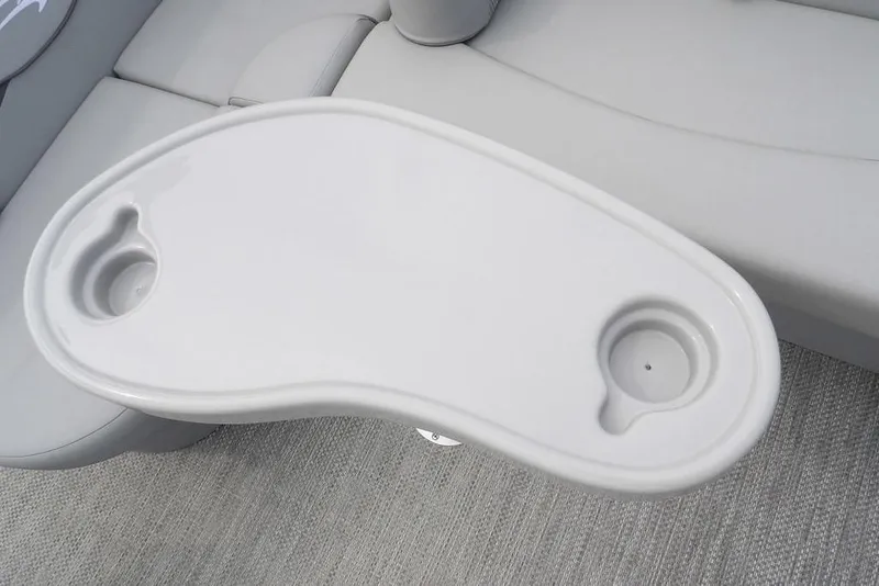 Slide: The Image of 2023 Bennington 20 SVF boat table with cup holders, featuring sleek white design. - 29