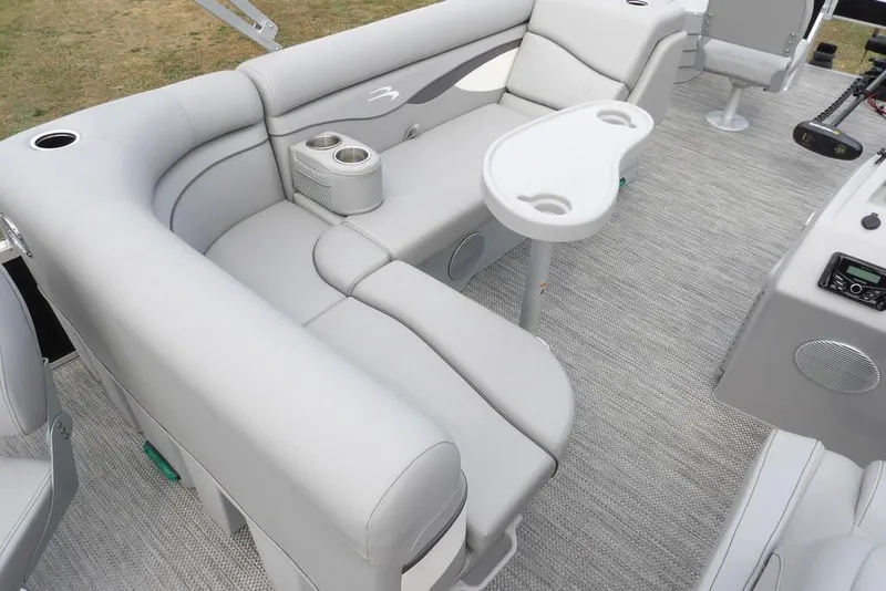 Slide: The Image of 2023 Bennington 20 SVF pontoon boat interior with plush seating and cup holders. - 30