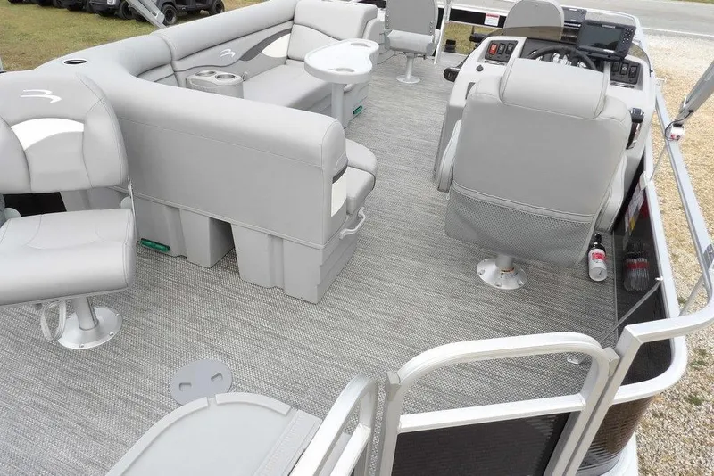 Slide: The Image of 2023 Bennington 20 SVF pontoon boat interior with gray seating and modern helm. - 32