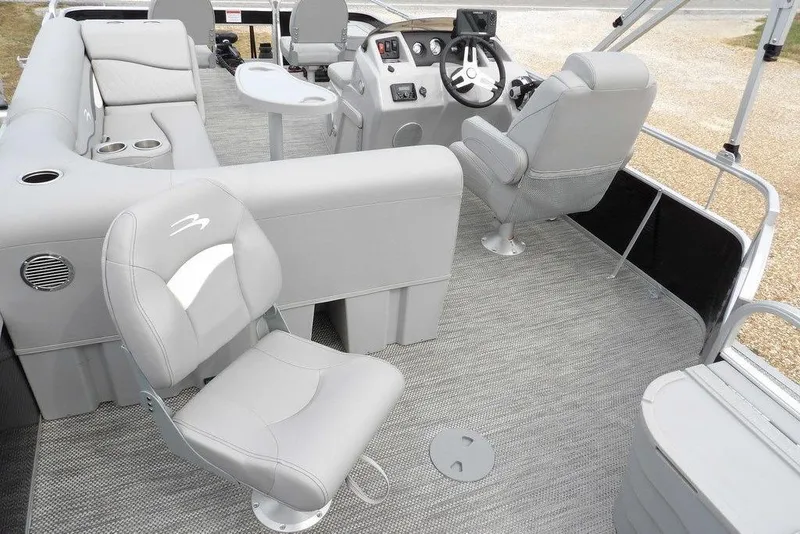 Slide: The Image of 2023 Bennington 20 SVF boat interior with gray seating and steering console. - 36