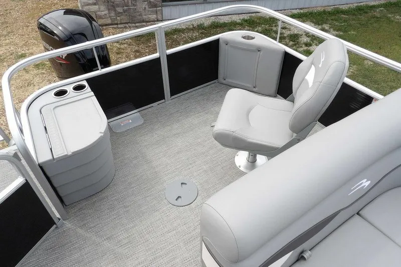 Slide: The Image of 2023 Bennington 20 SVF pontoon boat interior with gray seating and storage area. - 37