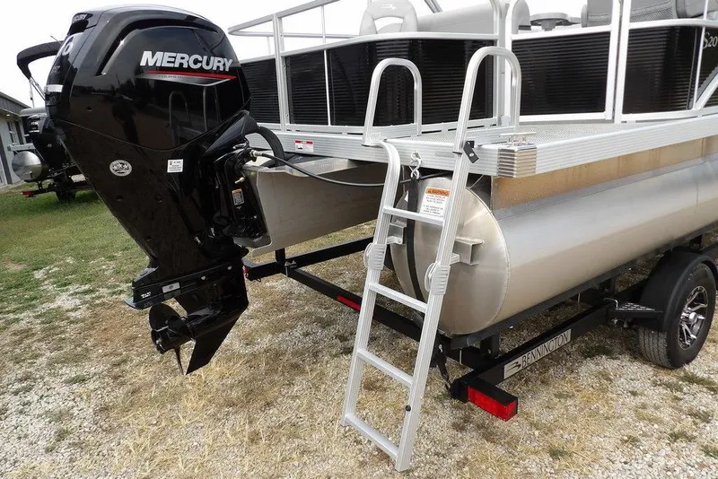 Slide: The Image of 2023 Bennington 20 SVF pontoon boat with Mercury outboard motor and boarding ladder. - 38