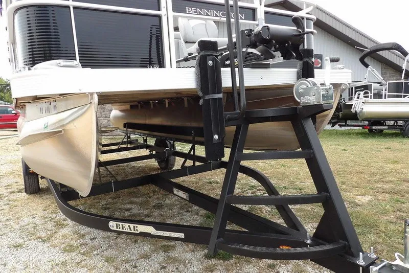 Slide: The Image of 2023 Bennington 20 SVF pontoon boat on trailer, displayed outdoors. - 41