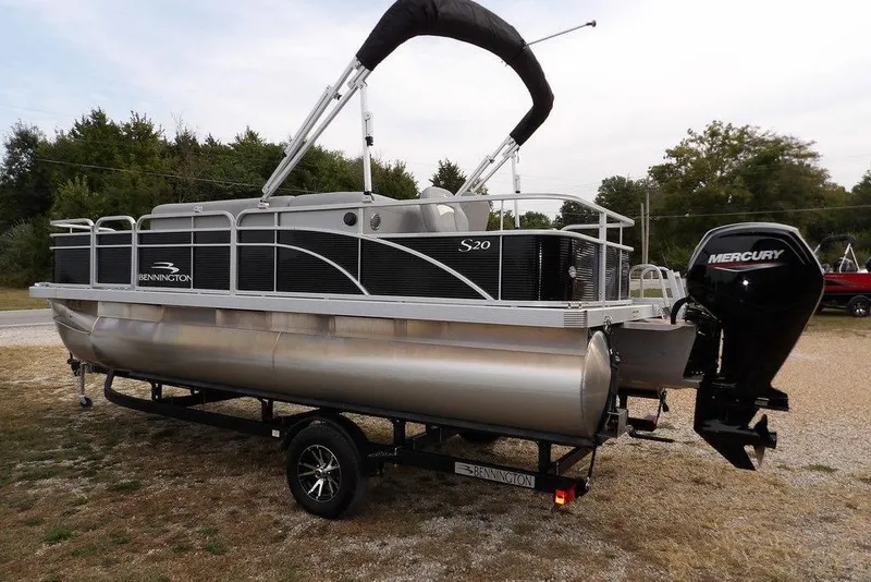 Slide: The Image of 2023 Bennington 20 SVF pontoon boat with Mercury outboard motor on trailer. - 5