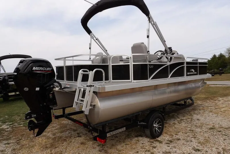 Slide: The Image of 2023 Bennington 20 SVF pontoon boat with Mercury outboard engine on trailer. - 7