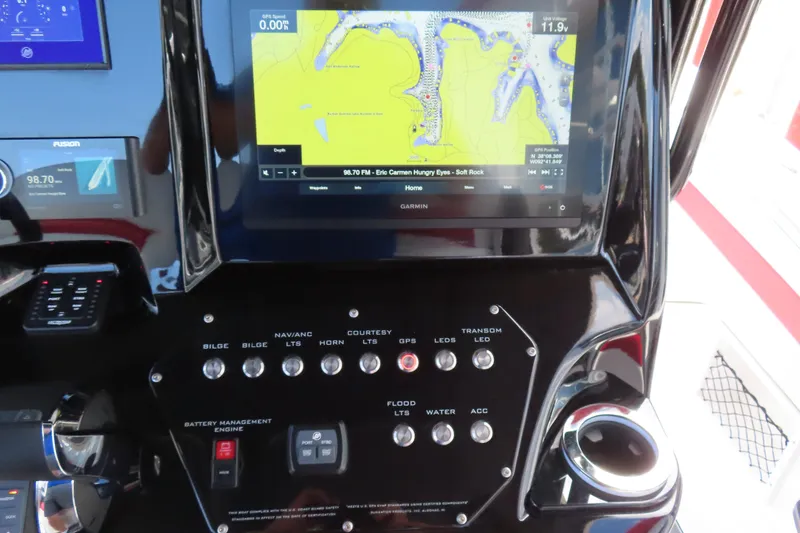 Slide: The Image of 2022 Sunsation 32CCX boat dashboard with navigation screen and control panel. - 16