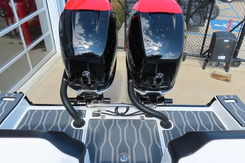 Slide: The Image of 2022 Sunsation 32CCX boat with dual outboard engines, docked on patterned flooring. - 19