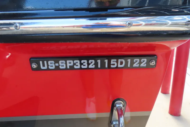 Slide: The Image of 2022 Sunsation 32CCX boat with visible hull identification number on red exterior. - 22