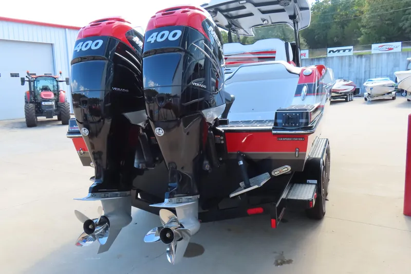 Slide: The Image of 2022 Sunsation 32CCX boat with dual Mercury 400 Verado engines, parked outdoors. - 5