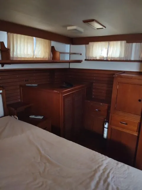 Slide: The Image of Interior of 1999 Grand Banks 42 Motoryacht with wooden cabinetry and soft lighting. - 39