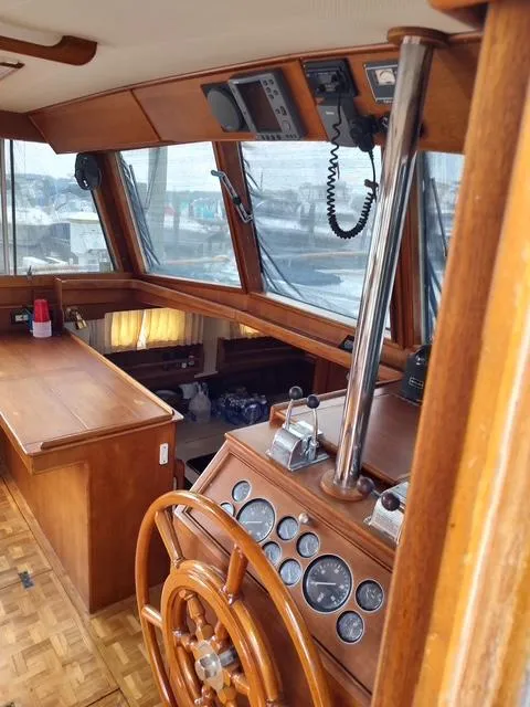 Slide: The Image of Interior of 1999 Grand Banks 42 Motoryacht with wooden helm and navigation instruments. - 46