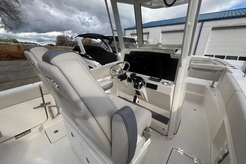 Slide: The Image of 2026 Sailfish 252 CC boat interior with modern helm and seating. - 16