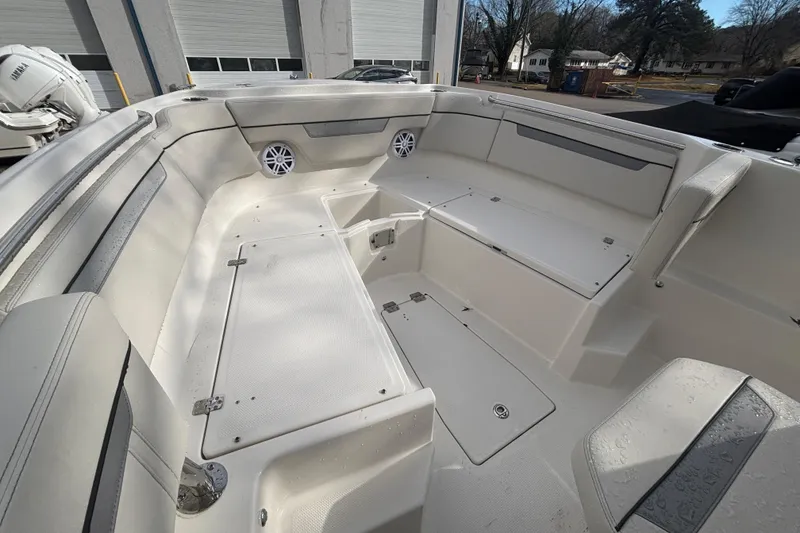 Slide: The Image of 2026 Sailfish 252 CC boat interior with spacious seating and storage compartments. - 18