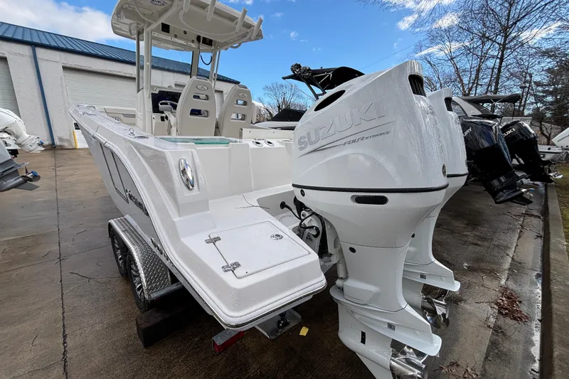 Slide: The Image of 2026 Sailfish 252 CC boat with Suzuki outboard engines on a trailer. - 25