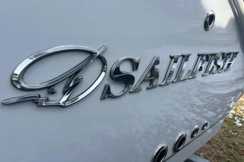 Slide: The Image of Close-up of Sailfish 252 CC logo on a boat, year 2026. - 31