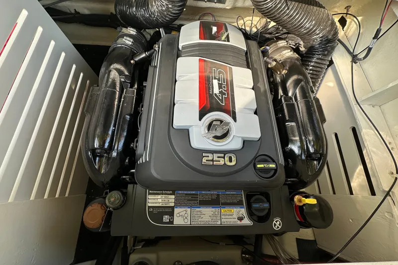Slide: The Image of Engine compartment of 2024 Sea Ray SPX 210 boat, featuring a 250 horsepower engine. - 17