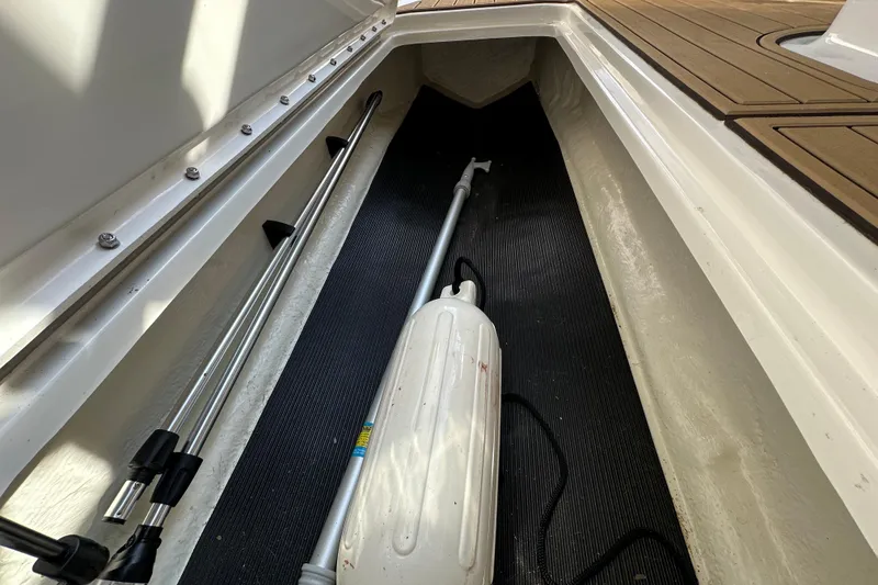 Slide: The Image of 2024 Sea Ray SPX 210 storage compartment with equipment and accessories. - 9