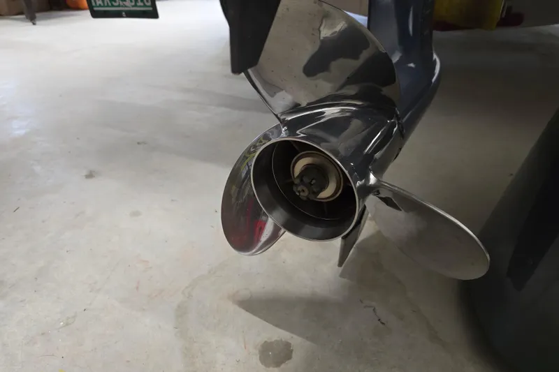 Slide: The Image of 2019 NauticStar 231 Hybrid boat propeller on a concrete floor. - 19