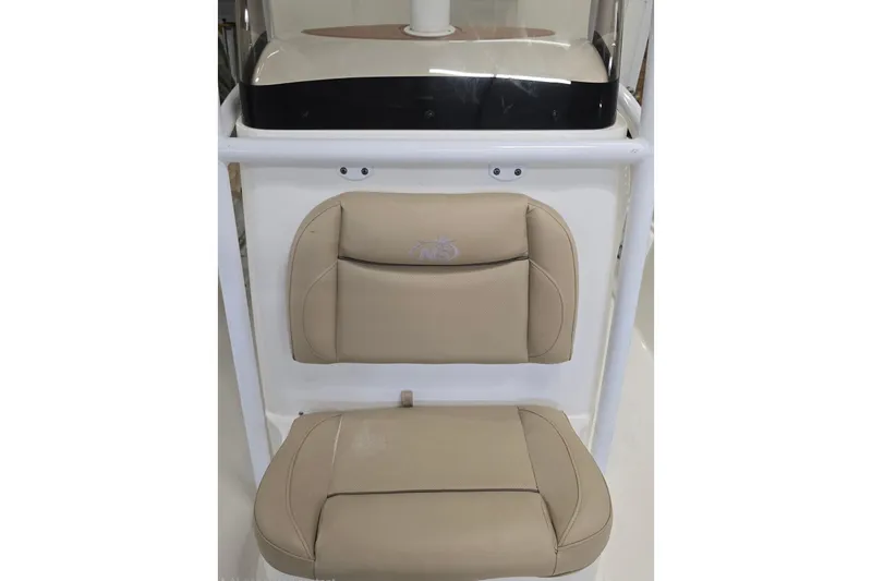 Slide: The Image of 2019 NauticStar 231 Hybrid boat seat with beige cushions and white frame. - 27