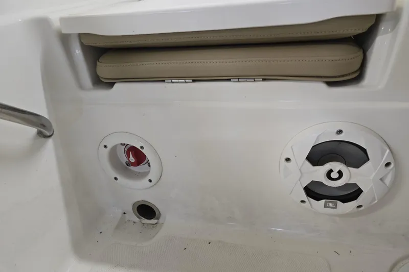 Slide: The Image of 2019 NauticStar 231 Hybrid boat interior with speaker and storage compartment. - 29