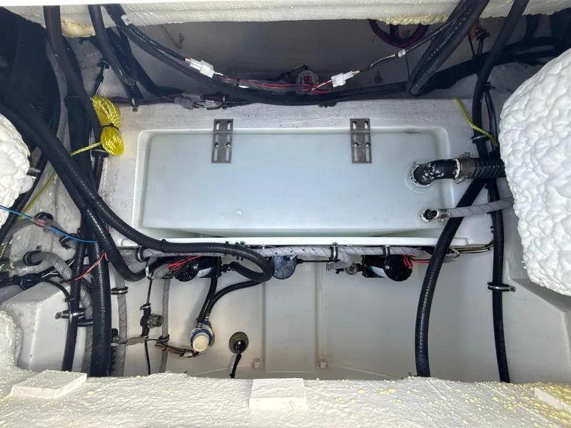 Slide: The Image of 2024 Sea Hunt Ultra 275 SE boat interior wiring and components. - 27