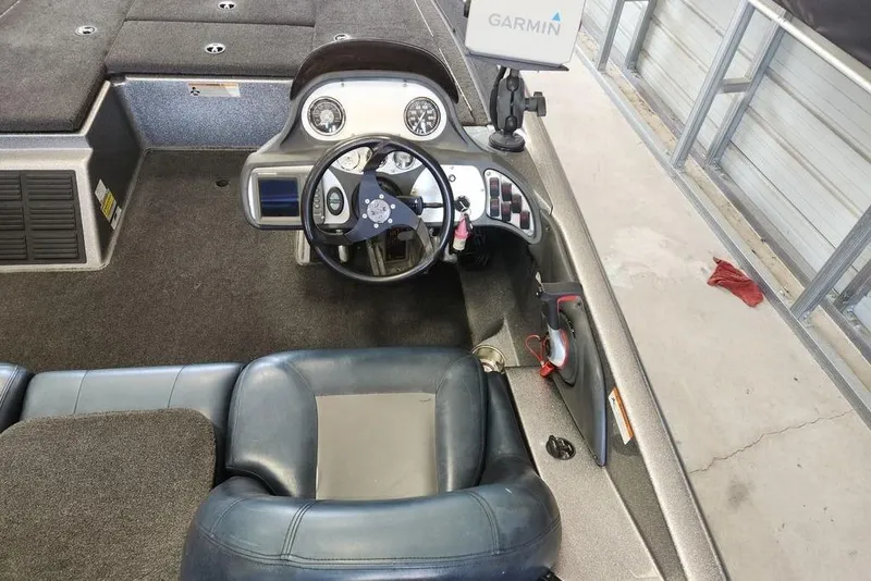 Slide: The Image of 2007 Ranger 188VS Intracoastal boat interior with steering wheel and Garmin device. - 6