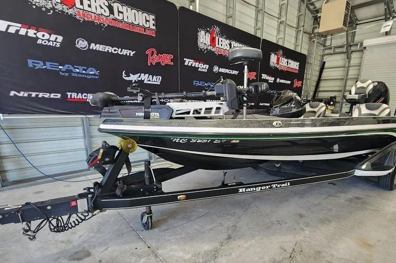 The Image of 2020 Ranger Z520L boat on trailer in showroom with branded backdrop. - 1