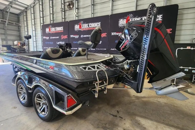 Slide: The Image of 2020 Ranger Z520L boat with powerful engine in a garage setting. - 8