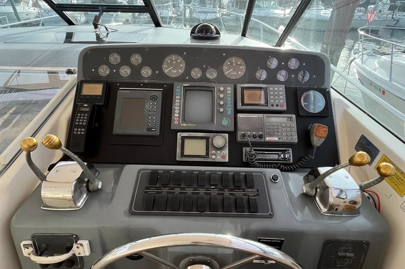 Slide: The Image of Control panel of a 1994 Tiara Yachts 4000 Express with navigation instruments. - 12