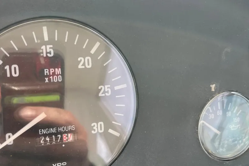 Slide: The Image of Dashboard of 1994 Tiara Yachts 4000 Express showing RPM and engine hours. - 14