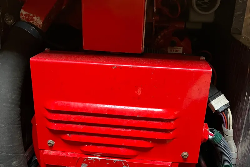 Slide: The Image of Red engine component inside a 1994 Tiara Yachts 4000 Express. - 29