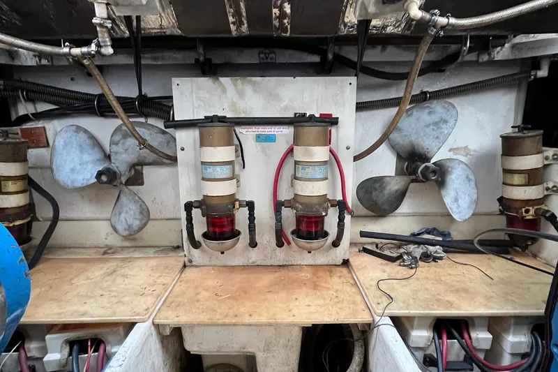 Slide: The Image of Engine room of 1994 Tiara Yachts 4000 Express with filters and propellers. - 32