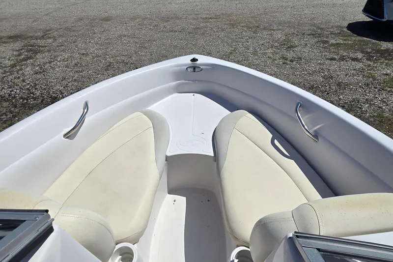 Slide: The Image of 2011 Tahoe Q5i boat interior with white seating and stainless steel handles. - 12