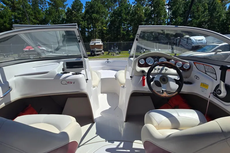 Slide: The Image of Interior of a 2011 Tahoe Q5i boat with steering wheel and dashboard. - 15