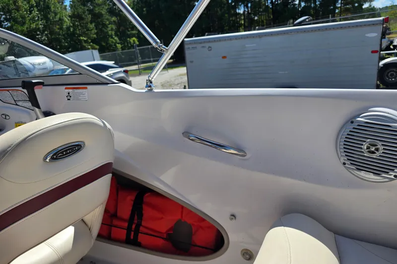 Slide: The Image of Interior of a 2011 Tahoe Q5i boat with seating and speaker. - 23