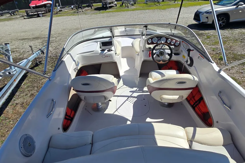Slide: The Image of 2011 Tahoe Q5i boat interior with steering wheel, seats, and dashboard controls. - 8