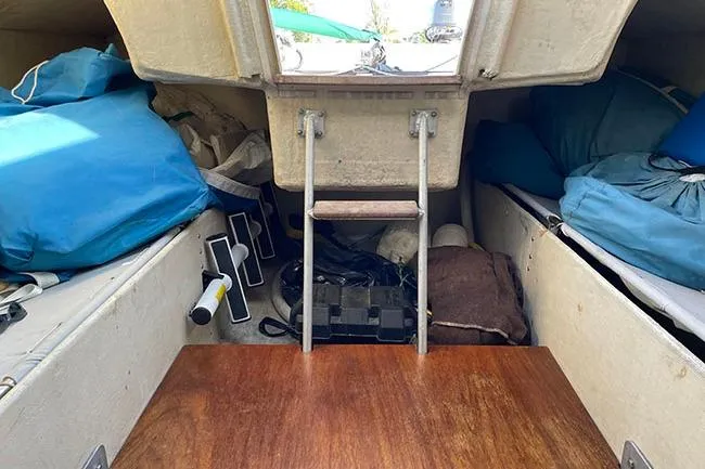 Slide: The Image of Interior of 1985 S2 K model sailboat with storage and ladder. - 13