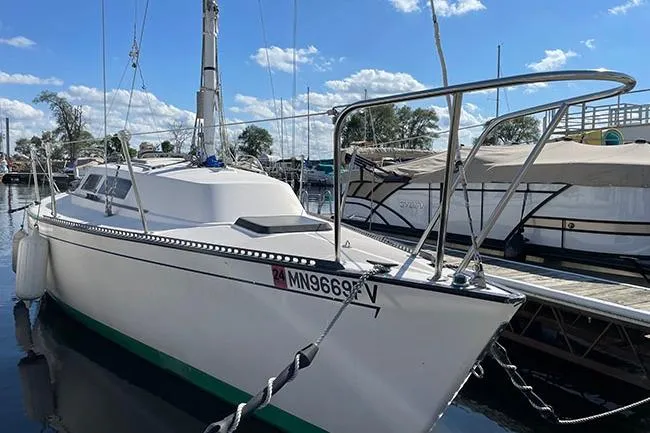 Slide: The Image of 1985 S2 K sailboat cockpit with white seating and wooden panel. - 6