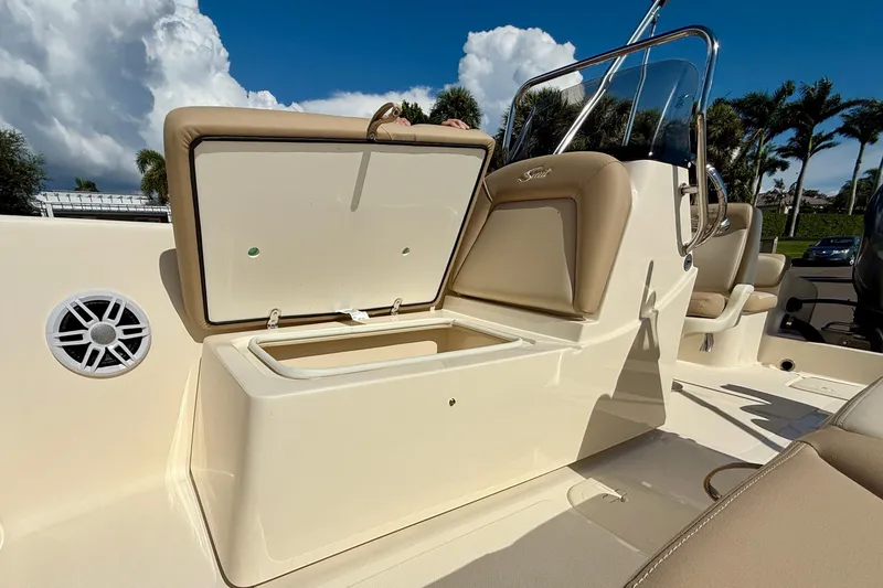 Slide: The Image of 2026 Scout 175 Sport Dorado boat interior with open storage compartment and seating. - 21