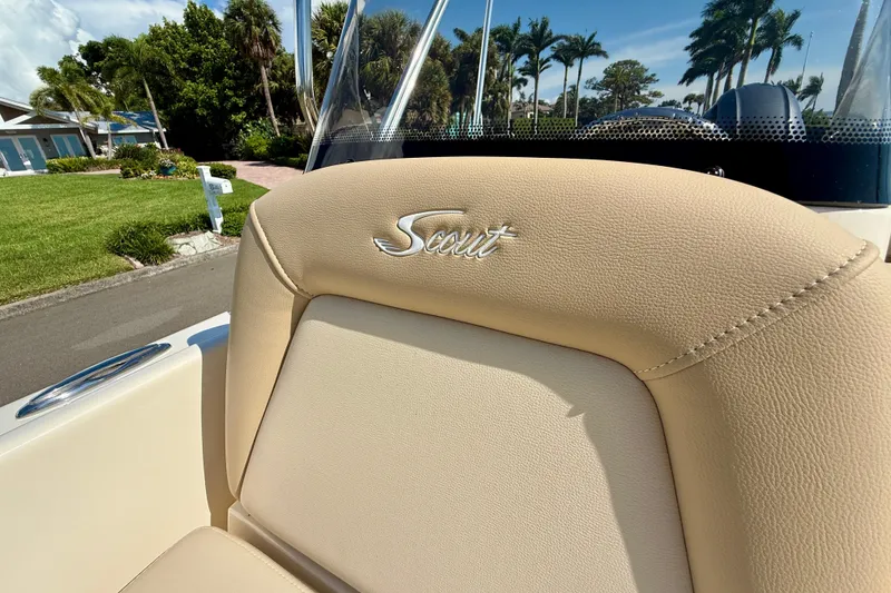 Slide: The Image of 2026 Scout 175 Sport Dorado boat seat with logo, outdoor setting. - 23