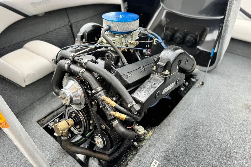 Slide: The Image of 1999 Malibu Sunsetter LX boat engine, detailed view of components and interior layout. - 18