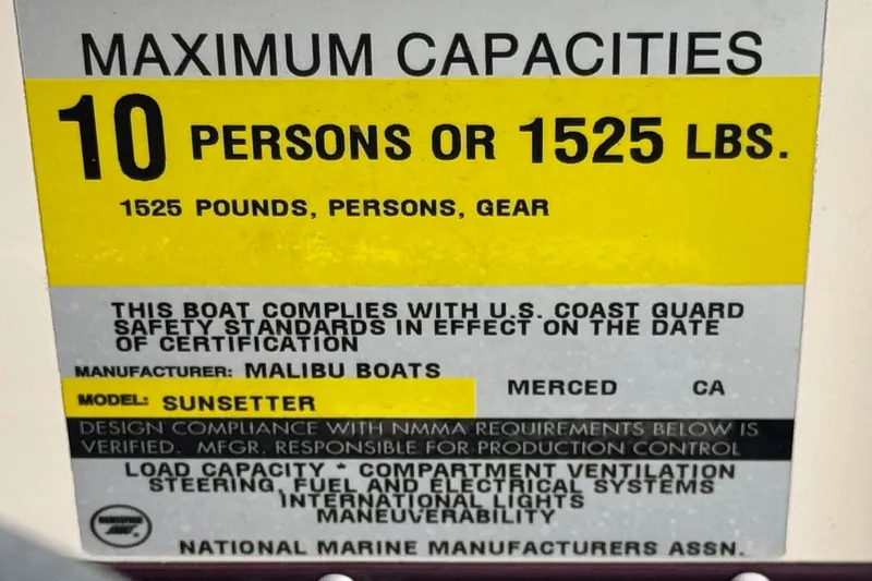 Slide: The Image of 1999 Malibu Sunsetter LX capacity label, maximum 10 persons or 1525 lbs, U.S. Coast Guard compliant. - 28