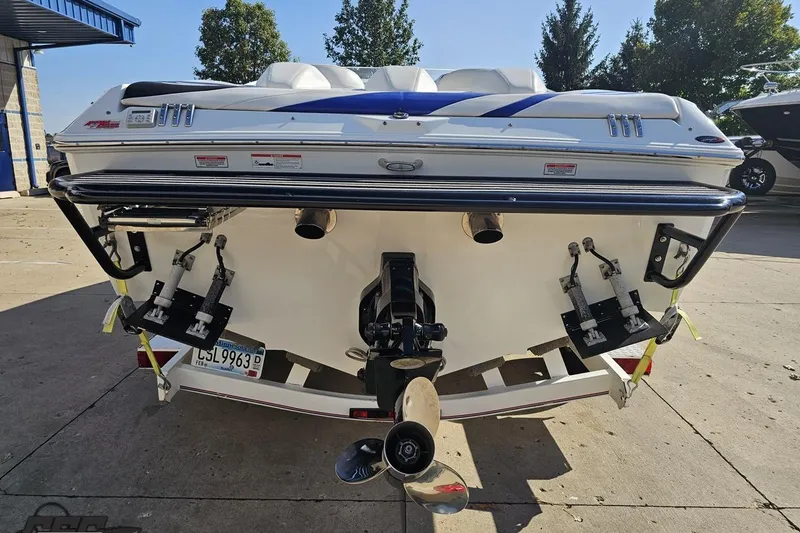 Slide: The Image of Rear view of a 2005 Baja 23 Outlaw boat with dual exhaust and propeller. - 33