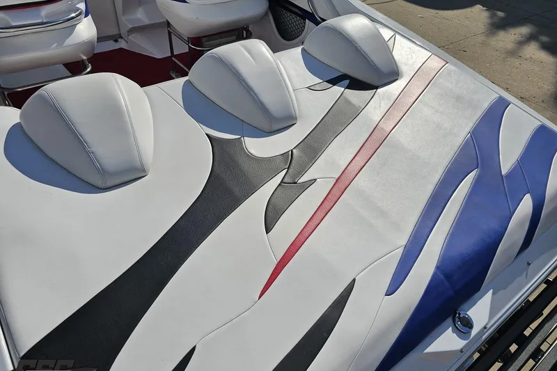 Slide: The Image of 2005 Baja 23 Outlaw boat interior with colorful, stylish upholstery design. - 38