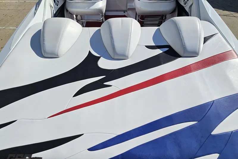 Slide: The Image of 2005 Baja 23 Outlaw boat interior with colorful upholstery design. - 41